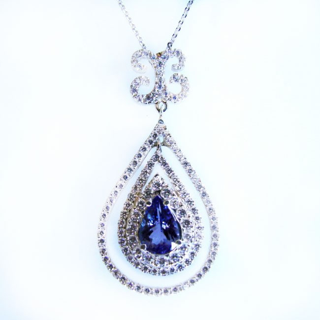 Pendant Natural Diamond & Tanzanite 5.63Ct 14k W/g: Gem Type: Natural Diamond and Tanzanite Item Pendant 125 Pieces Diamond weight: 3.52 carat Round brilliant Clarity: SI2,Color: H,Treatment: None Tanzanite: 2.11 carat Pear Shape Clarity: VS,Color: Blu