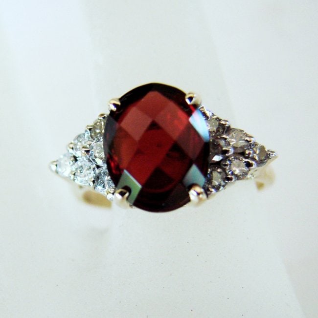 Anniversary Ring Natural Diamond Garnet 3.94Ct 14k Y/g: Gem Type: Natural Diamond and Garnet Item: Ring (Size: 7) Band thickness: 2-3mm 12 Pieces weight: .58 carat Rounds Brilliant Clarity: SI1, Color: H, Treatment: None Garnet Weight: 3.36 carat oval shap