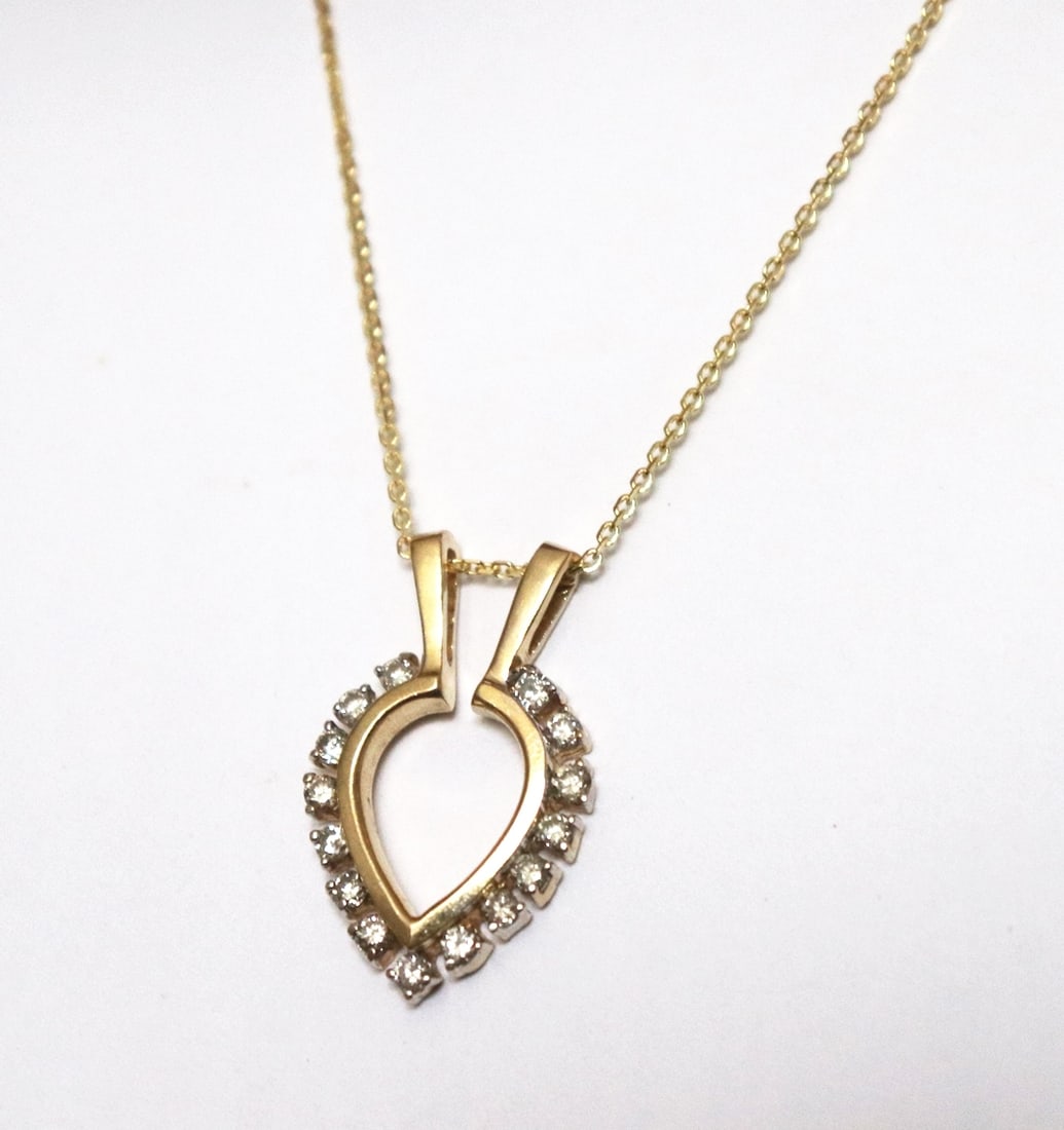 Heart Pendent Diamond .75Ct 14k Yellow Gold: Gem Type: Natural Diamond Pendant Diamond total weight: .75 carat Clarity: SI2, Color: G, Treatment: None Setting: Prong Metal: 14K yellow gold Weight: 5.30 grams L 1.25"x W .75"inch Style: Heart desi