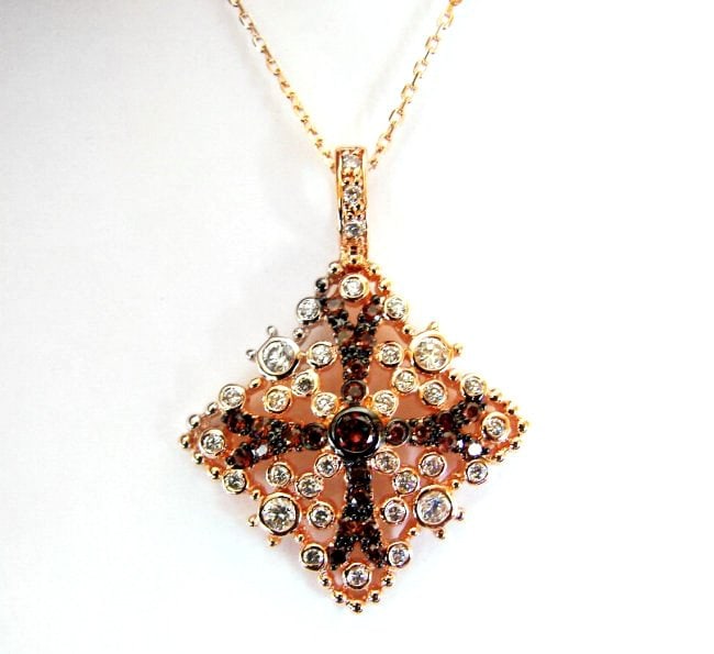 Creation Diamond W-B Pendant 3.37Ct 18k R/g Overlay: Gem Type: Creation Diamonds White and Brown High Quality Item:Pendant 35 Pieces White Weight: 1.73 carat Round Clarity: VS, Color F 25 Pieces Brown Weight: .53 Carat Round Clarity:VS-Color:Brown Setti
