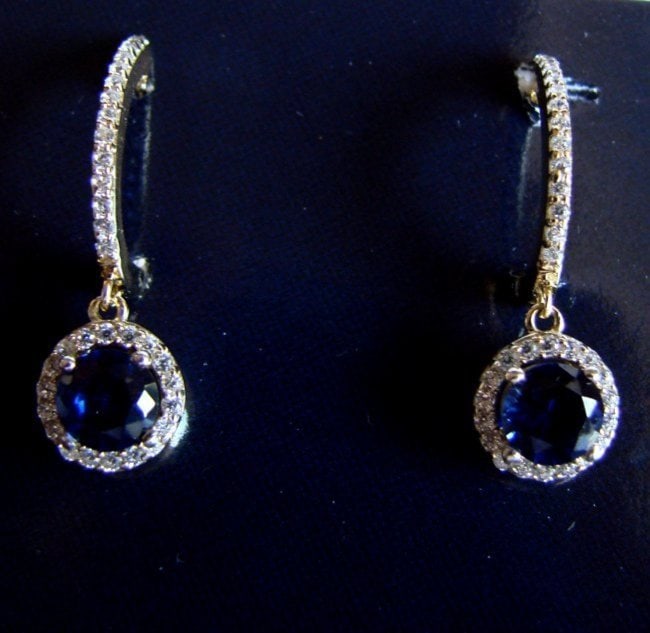 Creation Diamond-Sapphire Earring 2.81Ct18k Y/g Overlay: Creation Diamond and Sapphire High Quality item Quantity: 1 Pairs Length: 1" Center: 2.18 carat Measurement: 6 mm Clarity: VS, Color: Blue Creation Diamond Weigth: .63 Carat Clarity: VVS, Color: F <