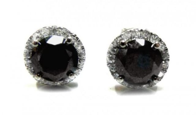 Earring Black White Diamonds1.78ct 14k W/G: Gem Type: Black and White Diamonds Quantity: 1 Pairs Item: Earrings Center Stones Weight: 1.58 carat round shape Size: 6 x 4mm (Clarity: Opaque, Color: Fancy Black) Surrounding diamond weight: .20 Car