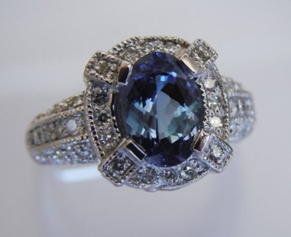 Nature Tanzanite & Diamond Ring 4.87 Ct14k Y/g: Gem Type: Natural Diamond / Tanzanite Ring Item: Ring Diamond weight: .66 carat 22 pieces round brilliant Clarity SI-1, Color: G, Treatment: None Tanzanite: 4.21 carat Oval Facet Clarity: VS2, Color: 