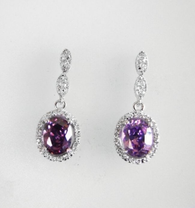 Creation Diamond/Amethyst Ear 3.83Ct 18k W/g Overlay: Gem: Creation Diamond/Amethyst Qty: 1 Item: Earrings Center stone: 3.00carat oval shape, size 8x7mm (Clarity: VSI, Color: Violet) Creation Diamond: . 83 carat round (Clarity: VSI, Color: E) Metal: