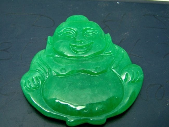 Natural Carved Jade Pendant Grade: A: Handwork Jadeite Carving Buddha God Carving Both Size Item Type: Pendants Grade: A Origin: China (Mainland) Color: Dark Green Texture Style: Trendy Jade Weight: 26.73 grams Size: H 2" x W 1.75"