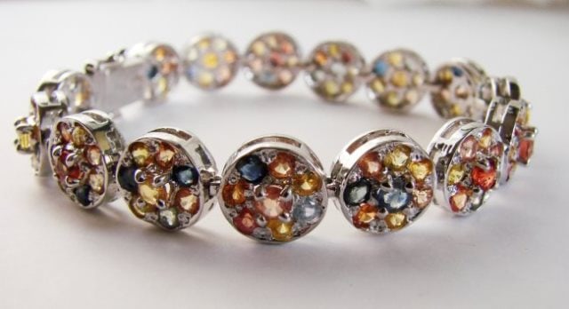 Natural Multi Sapphire Bracelet 16.95CT 18k W/g: Gem Type: Natural Beautiful Multicolor Sapphire High Quality Item Item: Bracelet Sapphire 120 Pieces Weight: 16.95 Carat Shape: Round Facet (Clarity: SI/Color: Blue, Yellow, Golden, Red/Treatment: