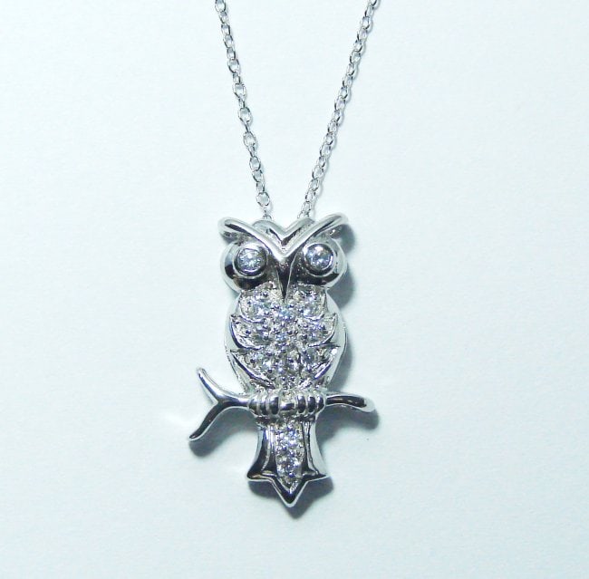 Creation Diamond/ Necklace .65CT 18k W/G Overlay: Gem: Creation Diamond Pendant size: 1"x1/2" inch Item: Pendant 13Pisces weight: .65 carat round brilliant Clarity: VVS1 Color: F Metal: 18k white gold overlay 925 silver (4.89grm) Figure: Owl