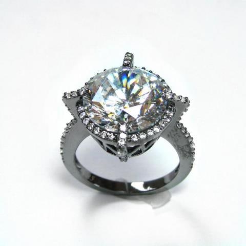 Creation Diamond/ 5.32 Carat 18k B/g Overlay: Gem: Creation Diamond High Quality Qty: 1 Item: Ring Face: 12x12mm Small stone: 1.00 carat round brilliant Center stone: 4.32 Carat round brilliant Clarity: VVS1 Color: F Size: 7 Metal: 1