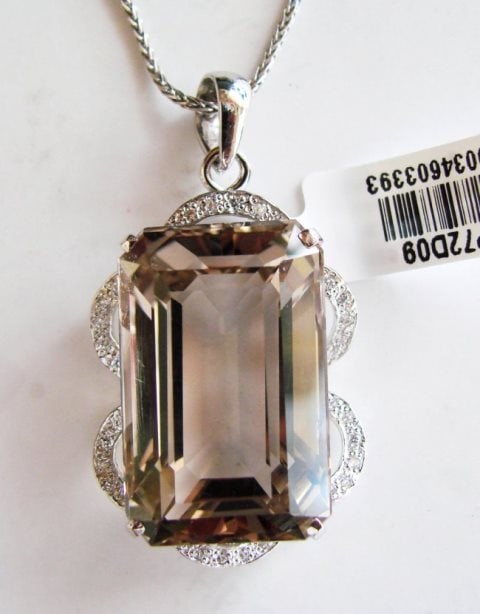 Smoky Topaz Pendant 37.44Ct 18k W/g Overlay: Gem Type: Natural Smoky Topaz/Creation Diamond Quantity: 1 Smoky Topaz: Approx 37.44 Carat (Octagon Shaped, Facet, Size: 28x17xx11mm) Clarity: VS1, Color: Light Brown, Treatment: None Hardness 7 Origi