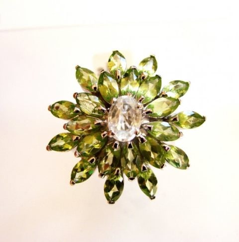 Peridot &White Topaz Ring 7.39Ct 18k W/g Overlay: Gems Type: Natural Peridot and White Topaz Item: Ring Size: 8 23 Pieces, Marquise Shape Weight: 6.22 Carat Clarity: Transparent Color: Green Treatment: None Origin: Brazil Center White Topaz O