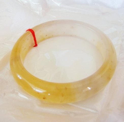 Natural Jadeite Jade Bangle Grade B Size 8: Natural Jadeite Jade Bangle Grade: B, Color: Golden and Creamery White Transparency: Semi -Transparent Shape & Cut: Solid Jade Band Haft Round Jade Finish: High Polish Remarks: Genuine Jadeite Quality