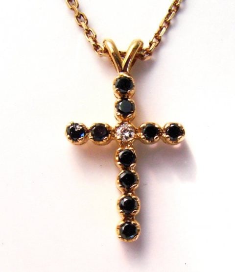 Black&White Diamond Cross Pendaent 1.31Ct 14k Y/g: Gem Type: Natural Black and White Diamonds Item: Cross Pendant Center White Diamond 1 Pieces Weight: .11 carat Round Brilliant (Clarity: SI1 Color: H Treatment: None) Black Diamond 10 Pieces Weight: 1
