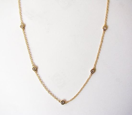 Creation, Diamond Pazel Chain .90Ct 18k Y/g Overlay: Gem Type: Creation Diamonds 10 Pieces Round Brilliant Weight: .90 Carat, Clarity: VVS, Color: F Metal: 18k Yellow Gold Overlay 925 Silver Weight: 2.21 gram, Chain: 17" Long Design: Pazel Setting 1.5"i