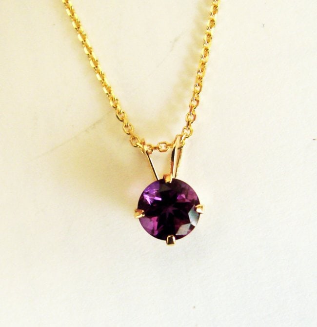 Pendant Amethyst Round 1.23Ct 14k Y/g: Gem Type: Natural Amethyst Item:Pendant Weight: 1.23 Carat Round Facet Measurement: 6x4 mm Clarity: VS,Color: Violet 14K Yellow gold and 1.98 grams Diameter: 10x6 mm Style: Unique Pendant will c
