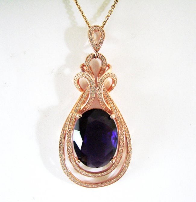 Creation Diamond Amethyst Pendant 19.48Ct 18k R/g Overlay: Creation Diamonds Amethyst Pendant High Quality Item Item: Pendant Center Weight: 18.20 carat Oval Shape Clarity: VVS, Color: White Measurement:20x15x8.5 mm Mouthing Stones:1.28 Carat Round Brilliant 