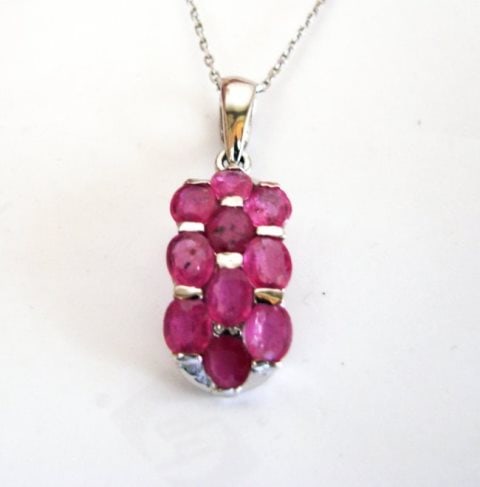 Natural Ruby Pendant 8.10Ct 18k W/g Overlay: Gems Type: Natural Ruby Item: Pendant High Quality Item Hand made by Handicraft 9 Pieces Ruby Measurement:6x4 mm,Weight:8.10 Clarity: SI,Color: Pink Red,Treament:Fracture Filled Shape:Oval Facet Origi
