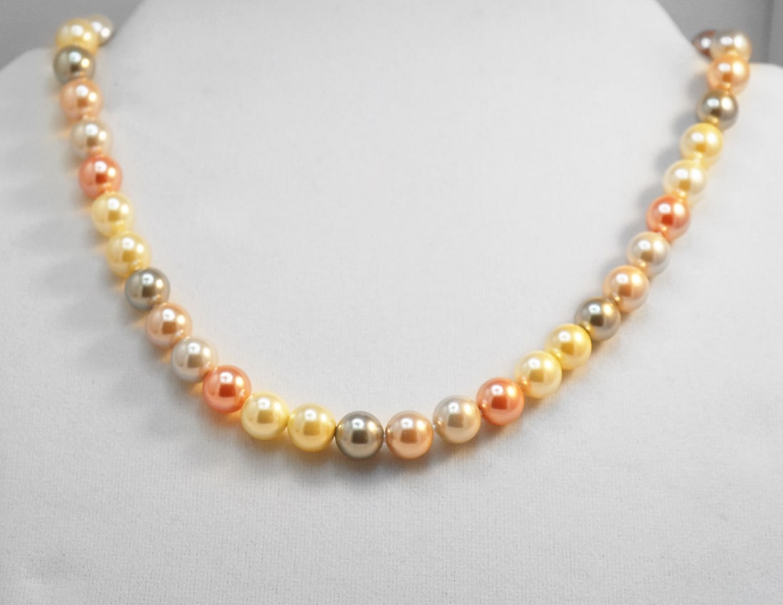Necklace Swarovski Pearl Necklace 10mm 925 Ball Clasp: Gems Type: Swarovski Crystal Pearl Measurement: 10 mm,42 pieces Grade: AAA Color: Multi-Color Luster: Excellent Length: 18.5 Inches Ball Clasp Knot: Each in Between Threat: Silk Conditi