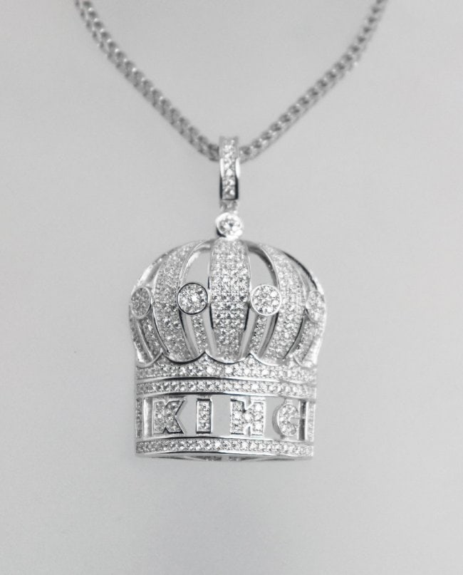 King Crown Pendant 18K W/G Overlay 925: Stone: Creation, Diamond ] Stone Total: Approx. 2.39 Carat round brilliant Pendant: King Crown (Clarity: VSI, Color: F Length: 1.5 inches, Width: 1. Inch Metal: 18k white gold over 925 silver (10.06