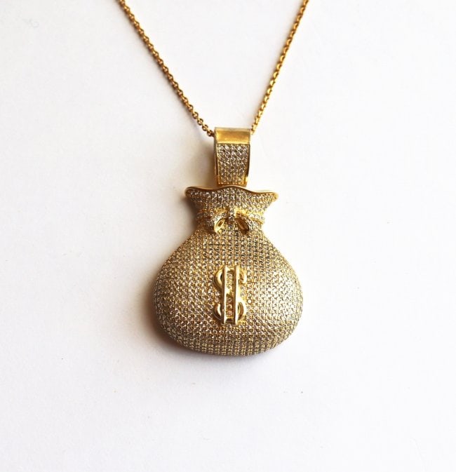 Hip Hop Money Bag Creation Diamond 2.10Ct 18k Y/g Overlay: Pendant: Money Bag Hip Hop Length: 1.70 Inches Width: 1.25 Inch Stone Total: Approx. 2.10 Carat round brilliant Clarity: VSI, Color: F Metal: 18k yellow gold overlay 925 silver (11.20 grams) No Chain