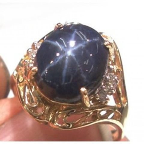 Blue Star Sapphire: 5.20 Ct Dia: .10 Ct 14k Y/g: Gem Type: Natural Cabochon Star Sapphire /White Diamond Item: Ring Quantity: 1 Diamond:.10 carat round brilliant (Clarity SI-3, Color: H-I) Cabochon Star Sapphire: 5.20 carat oval shape star sapphire 