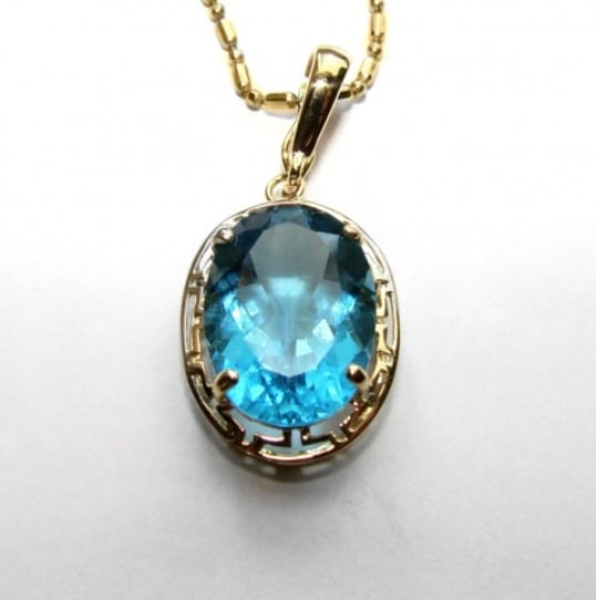 Blue Topaz Pendant 5.10 CT 14k Yellow Gold: Gem Type: Natural Topaz Blue Topaz: Weight 5.10 Carat oval shape Clarity: VVS Color: Swiss blue Gold: 14k solid yellow gold and (2.00grm) Length: 16mm Style: Simple Estimated Value Price: $2,121