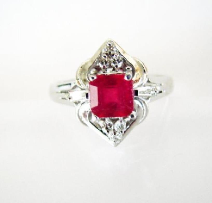 Ruby: 1.05CT & Diamond: .23CT Ring Ct 14k W/g: Gem Type: Natural Ruby Diamond Item: Ring (Size: 6.5) Diamond: .23 carat Round and baguette Clarity: SI2, Color: H, Treatment: None Ruby 1.05 carat Emerald cut Clarity: SI, Color Red, Treatment: Fract