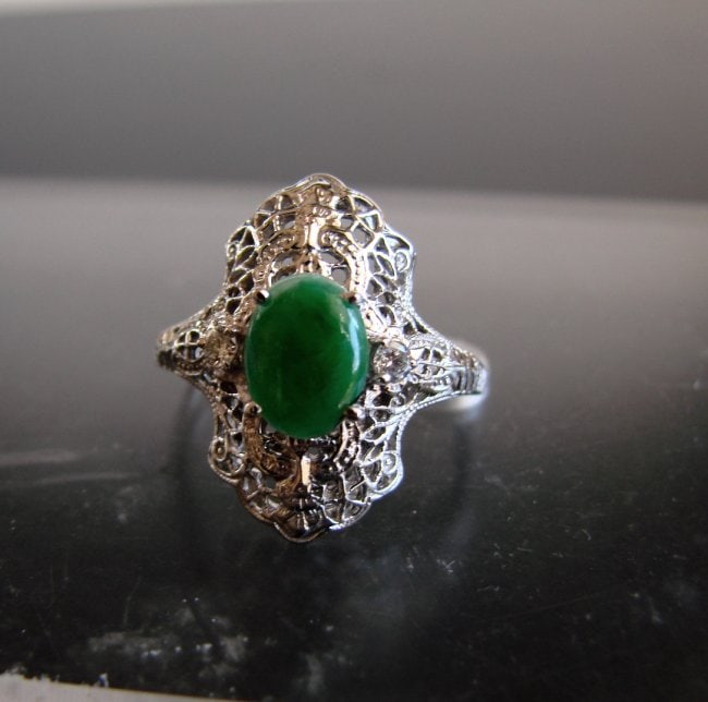 Anniversary Ring Imperial Jade/Diamond 1.04Ct 14k W/g: Gem: Natural Imperial Jade & Diamond Item: Ring Ring face diameter: 20x10 mm Jade Weight: .90 Carat Oval Cabochon Measurement: 8x6 mm Grade: A Clarity: Transparent,Color: Emerald Green Treatment: None