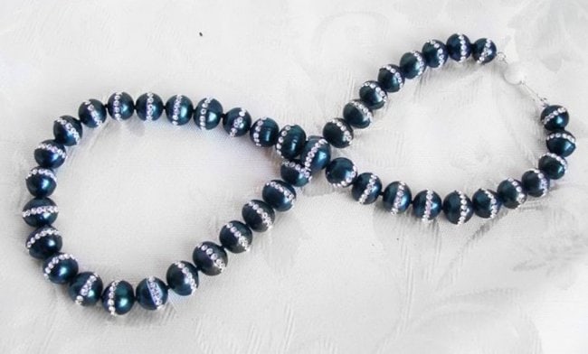 Necklace Culture Pearl/Crystal /925 Silver Ball Clasp: Gems Type: Natural Culture Pearl and Creation Daimond Grade: A, Color: Black Peacock Shape: of Round Measurement: 10 mm Creation Daimond 440 Pieces Weight 19.80 Carat Clarity VS Color G Necklace 18" L