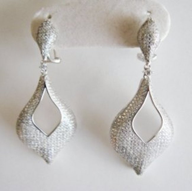 Creation Diamond Earrings 6.17Ct 18k W/g Overlay: Creation Diamond High Quality Qty: 1 Item: Earrings 769 Pieces Weight: 6.17 carat Round Brilliant Clarity: VVS, Color: F Length: 2"x Width 3/4" inch Setting: Micro Pave 18k White gold overlay 925 silv