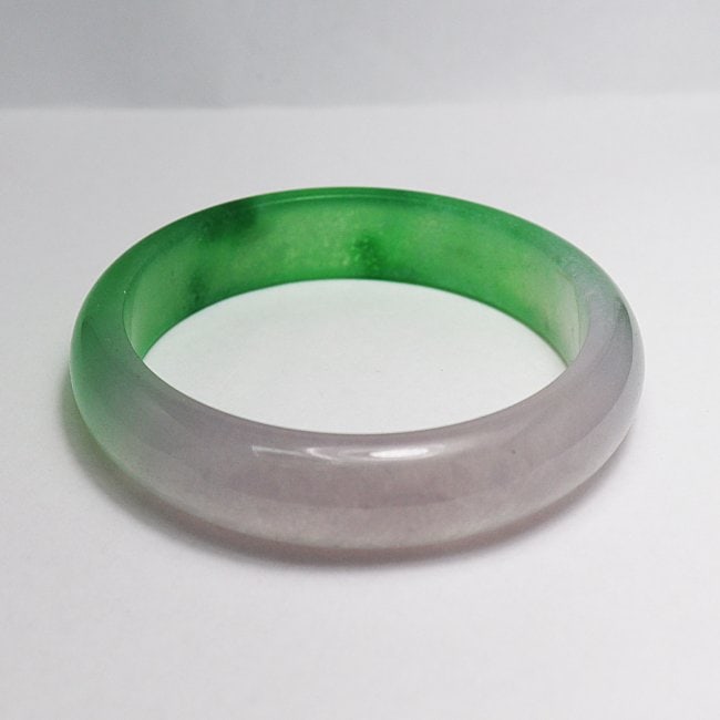 Translucent Solid Green/ Light Violet Chinese Jade Bang: Gem Type: Natural Translucent Solid Chinese Jade Grade: B Item: Jade Bangle, Size 7 Outer Diameter: 77 mm Inter Diameter: 60 mm Width: 15mm Thickness: 9 mm Weight 58.79 Treated: Untreated