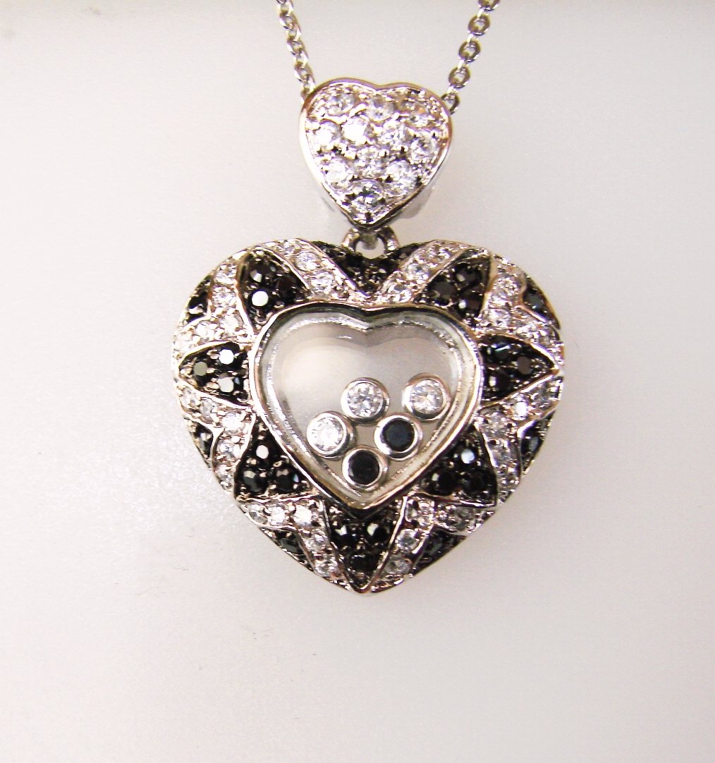 Creation Diamond W/B 2.51 CT Necklace 18k Y/G Overlay: Gem: Creation White/Black Diamond Qty: 1 Item: Necklace Length: 18.” Pendant size: L 30Xw25mm Stone weight: 2.51 carat round (Clarity: F/Opaque, Color: G, Black) Metal: 18k white gold overlay 925 si