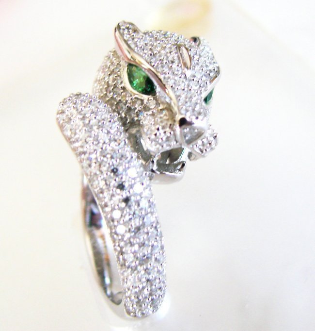 Creation Diamond Juguar Ring 3.65Ct18k W/G Overaly: Creation Diamond & Green Garnet Ring High Quality Item Item: Ring Weight:3.45 Carat Round brilliant Clarity: VVS,Color: F Green Garnet:.20 Carat Marquise Cut,Clarity:VVS,Color:Green Bend Thickness: 3-