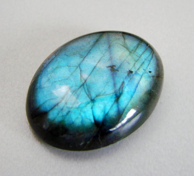 Natural Labradorite Oval Shape 43.14Ct 30x20x7.9mm: Gems Type: Natural Multicolor Labradorite Pear Shape Weight: 43.14Carat Size: 30x20x7.9 mm Cut: Pear Shape Cabochon Clarity: Translucent, Color: Multicolor Treatment: None, Hardness:6 Origin: Madagasc