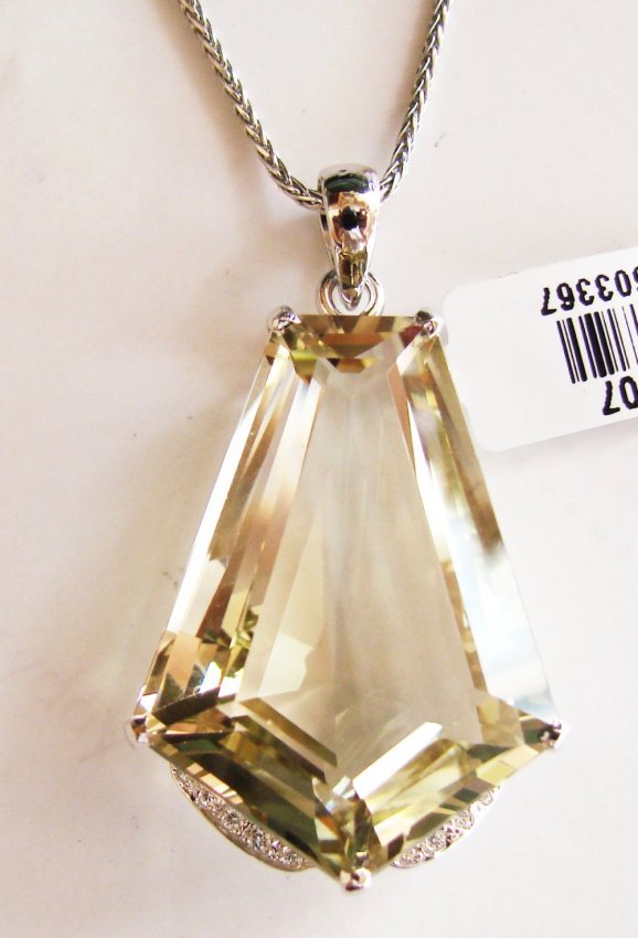 Lemon Topaz Pendant 26.02CT 26x18X13mm: Gem Type: Natural Lemon Topaz/Creation Diamond Quantity: 1 Lemon Topaz: Approx26.02 Carat (Baguette Cut, Facet, Size: 26x18x13mm) Clarity: VS1, Color: Medium Yellow, Treatment: None Hardness 7 Origin,