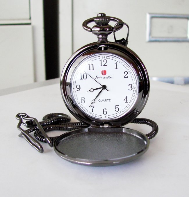 Pocket Watch 'L' Luis Cardini Stainless 14.5" Chain: Pocket Watch Luis Cardini Quartz Japan Movement, Stainless Case Black Color Design: Booth Side Smooth Size:1.3/4 x 1.3/4 mm Come With Chain 14.5"-Run By Battery Estimated Value Price: $350 Good For Th