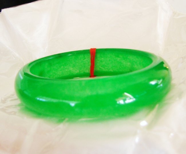 Natural Jadeite Jade Bangle JBA-2A Size 8: Natural Jadeite Jade Bangle Clarity: JBA-2A, Color: Green Transparency: Semi -Transparent Shape & Cut: Solid Jade Band Haft Round Jade Finish: High Polish Remarks: Genuine Jadeite Quality: Excellent L