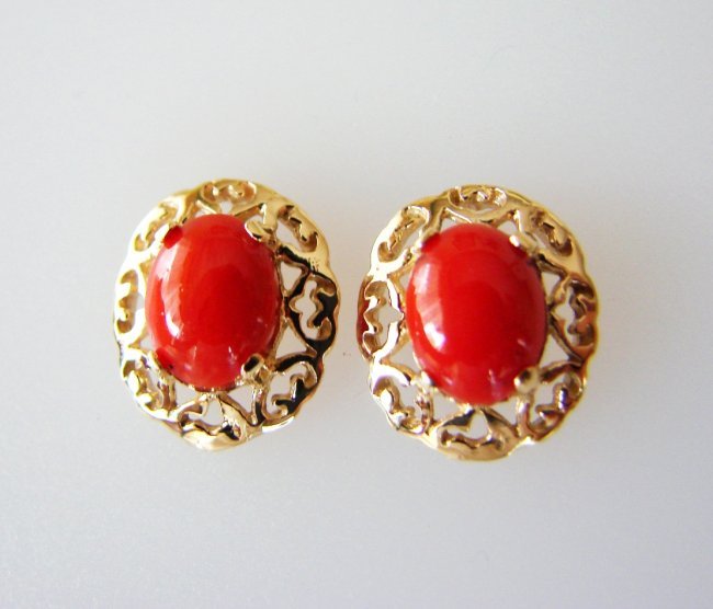 Natural Red Coral Earrings 2.09Ct14k Y/G: Gem Type: Natural Coral Earrings: 1 Pairs Weight:2.09 carat oval Cabochon shape Clarity: Opaque-Color:Red-Treatment: None Measurement:8x6 mm Origin: Taiwan Gold: 14k Yellow gold-Weight: 2.80 gram Back