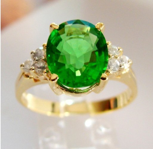 Green Tsavorite Ring: 2.15Ct Diamond: .30Ct 14kY/g: Gem Type: Natural Tsavorite/White Sapphire Item: Ring Quantity: 1 Diamond: .30 carat round (Clarity: VS1, Color: F) Tsavorite: 2.15 carat oval shape (Clarity VS1, Color: Green, Treatment: None, Origin