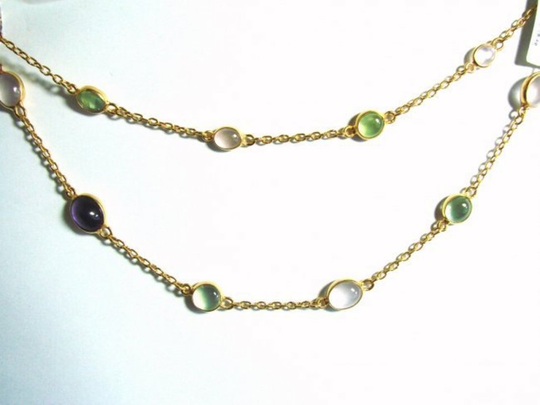 Cabochon Multi-Color 28.23Ct Necklace 18k Y/G Overlay: Gem Type: Natural Moonstone, Amethyst, Peridot Qty: 1 Item: Ordinary Necklace Gem Total Weight: 28.23 carat Length: 34â€ Natural Cabochon Amethyst: 4.10 carat oval shaped 2pcs Natural Cabochon Peri