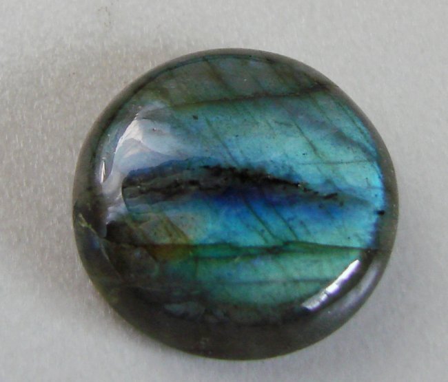 Natural Labradorite Round Cabochon 26.62Ct 21.6x7 mm: Gems Type: Natural Multicolor Labradorite Weight: 26.62 Carat-Round Cabochon Size: 21.6 x 7 mm Clarity: Translucent, Color: Multicolor Treatment: None, Hardness:6 Origin: Madagascar Estimated Value Pr