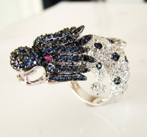 Creation Dia,sph,rb Dragon Ring 3.44Ct 18k W/G Overlay: Creation Diamond, Sapphire, Ruby Ring High Quality Item Item: Ring Weight: 3.44 Carat round brilliant Prong Setting L1.1/2" x W3/4",Thichness:2-4 mm 18k White gold overlay 925 silver Weight: 13.80gram