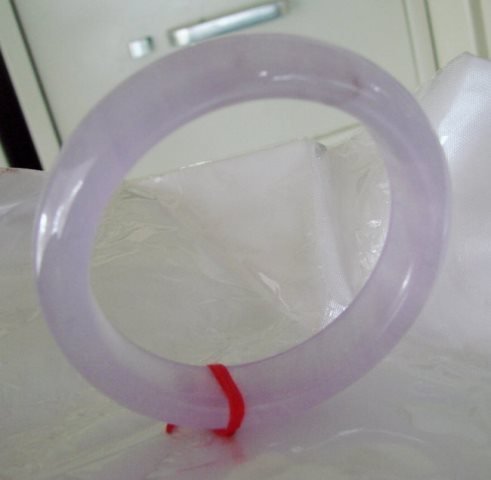 Natural Jadeite Jade Bangle JBA-B Size 7: Natural Jadeite Jade Bangle Qty: 1 Clarity: JBA-B, Color: Lavender Transparency: Semi -Transparent Shape & Cut: Solid Jade Band Haft Round Jade Finish: High Polish Remarks: Genuine Jadeite Quality: Ex