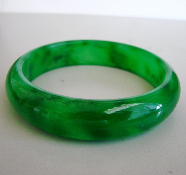 Natural Jadeite Jade Bangle Grade: A Size:7.75: Gem Type: Natural Jadeite Jade Item: Jade Bangle Grade: A Origon: China Color: Emerald Green an texture Transparency: Semi-Transparent Shape & Cut: Solid Jade Band Haft ways Round Jade Finish: Hand cu