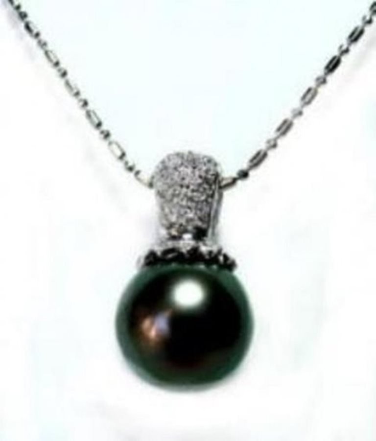 Tahitian Pearl Pendant 12 mm/Dia:37Ct 18K W/g: Gem Type: Natural Tahitian pearl and Diamond Quantity: 1 Diamond: .37 carat round (Clarity: VIS, Color: Color: F) Tahitian pearl: 12mm (Grade: AA+++, Color: Black, Luster: very nice, Shape: Of round) 