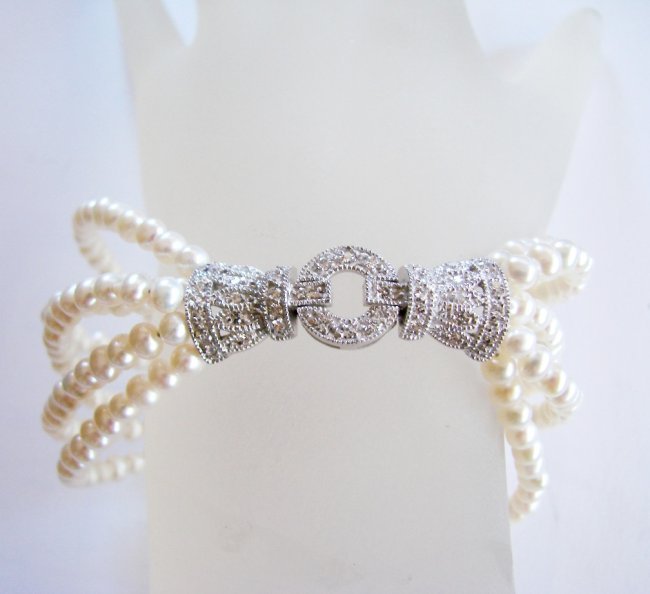 Bracelet Pearl Diamond Creation .29Ct 18k W/g Overlay: Gem Type: Natural Culture Pearl and Diamond Creation Item: Bracelet (Length: 7.5) Diamond Creation Weight: .29 Carat Round Brilliant larity: Clarity: VVS, Color: F Pearl: 3.5 mm, Grade: A Luster: Medi