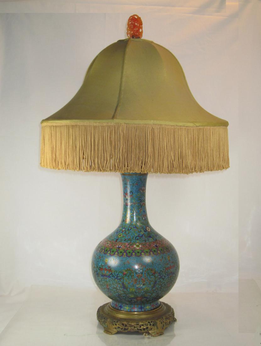 A Chinese Cloisonne Vase Mounted Lamp: Circa 1820-1850, enameled in floral pattern, lamp with oringinal gilt bronze stand (likely made by Farmer), finely carved agate pendant as final, two carved antique red and white age pendants as lamp