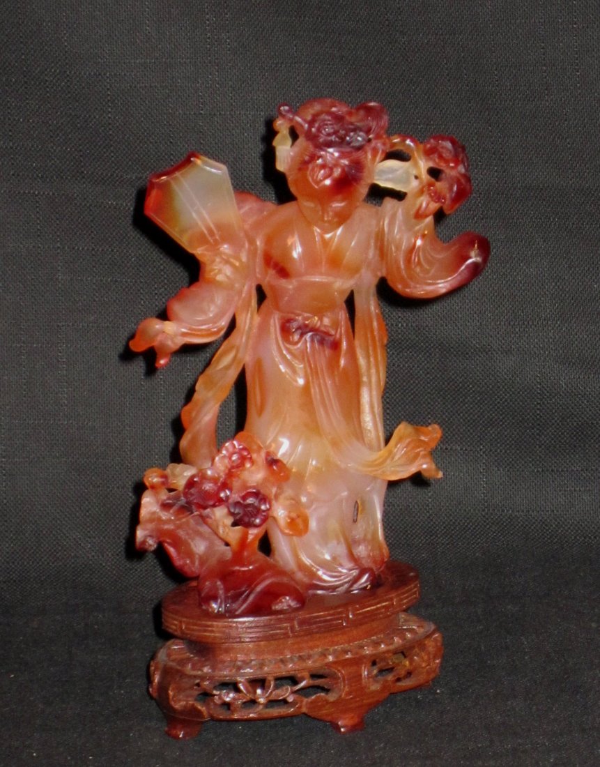 Chinese Carved Agate (Carnelian) Figure of A Lady: Chinese Carved Agate (Carnelian) Figure of A Beauty with Fitted Stand, holding flowers, good color of agate stone and fine quality carving, 20th Century, Overall Height 6.5" (16cm), Good condition