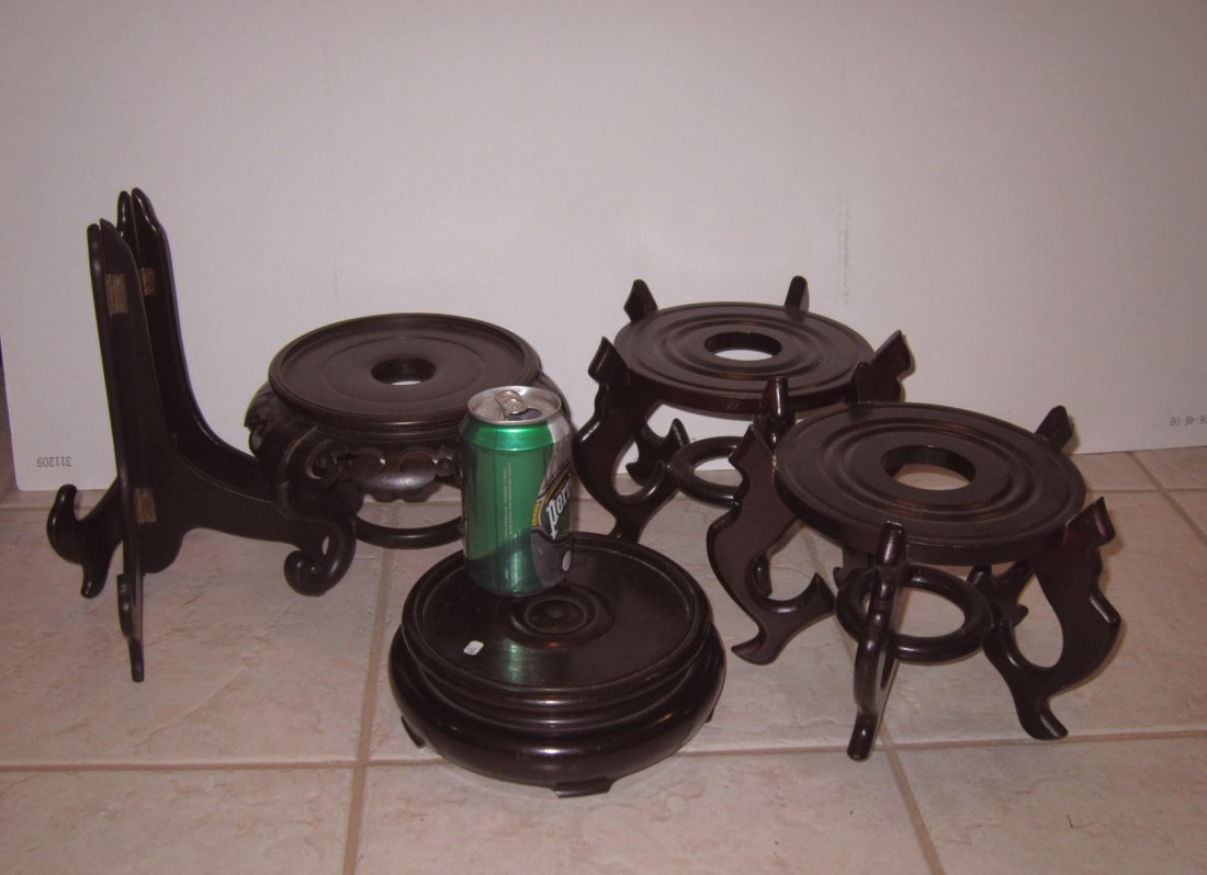 A Lot of Six Wood Stands Including 2 Pair: A Lot of Six Wood Stands Including a pair of vase stands and a pair of plate stands. Approximately Fit base Diameter 7" (17.5cm for the pair), 6.5" (16.5cm), and 6.25" (15.9cm).
