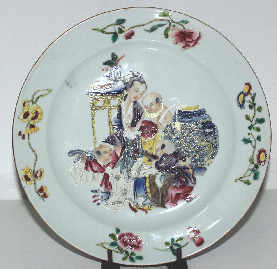 A Chinese porcelain 'figure' plate with ruby red ground (1 of 6)