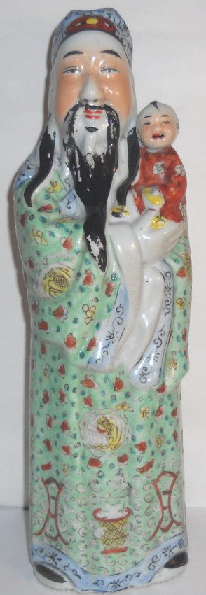A Chinese porcelain 'fortune' figurine.: A Chinese porcelain 'fortune' figurine, marked 'Ding Yi Sehng'. H: 42cm (16.5") Shipping within Canada & continental U.S.A. $45. Shipping to China $100. All other countries, please Email for shipping
